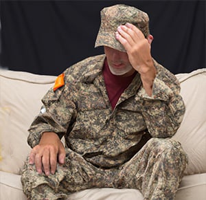 Worried US Veteran suffering from post traumatic stress disorder.